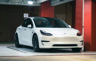 telsa-parked-in-a-parking-garage